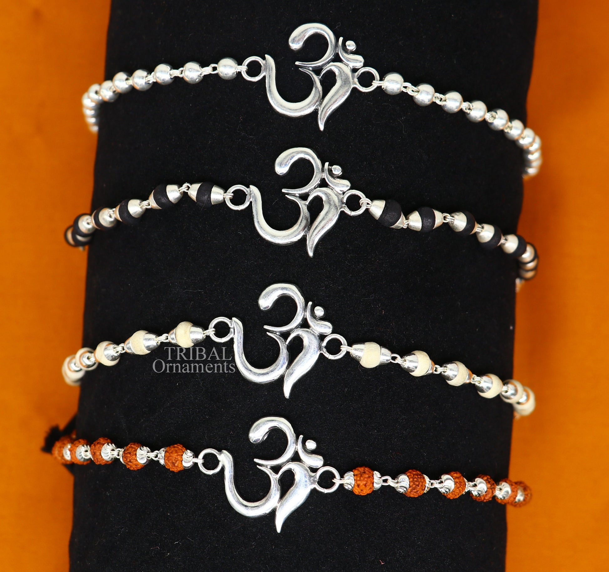 925 sterling silver Rudraksha and Tulsi beaded bracelet with OM design, handmade tribal ornaments for spiritual wrist adornment.