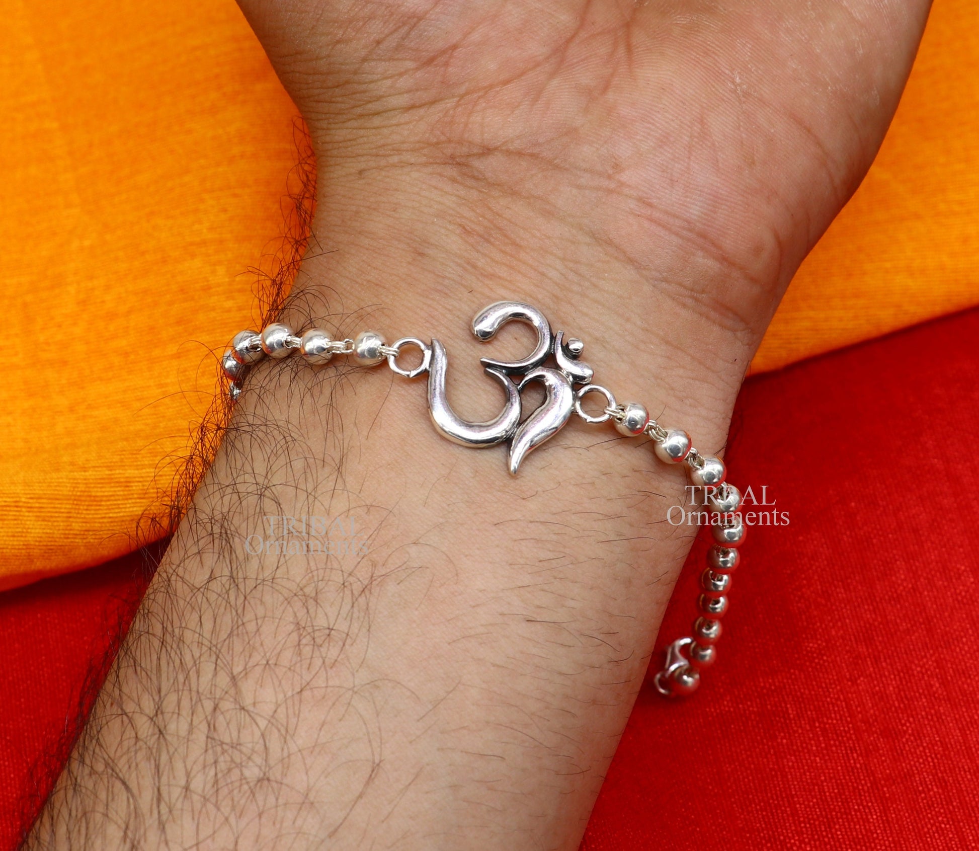 Handmade 925 sterling silver Rudraksha bead bracelet with OM design, featuring Tulsi beads, crafted by TRIBAL ORNAMENTS.