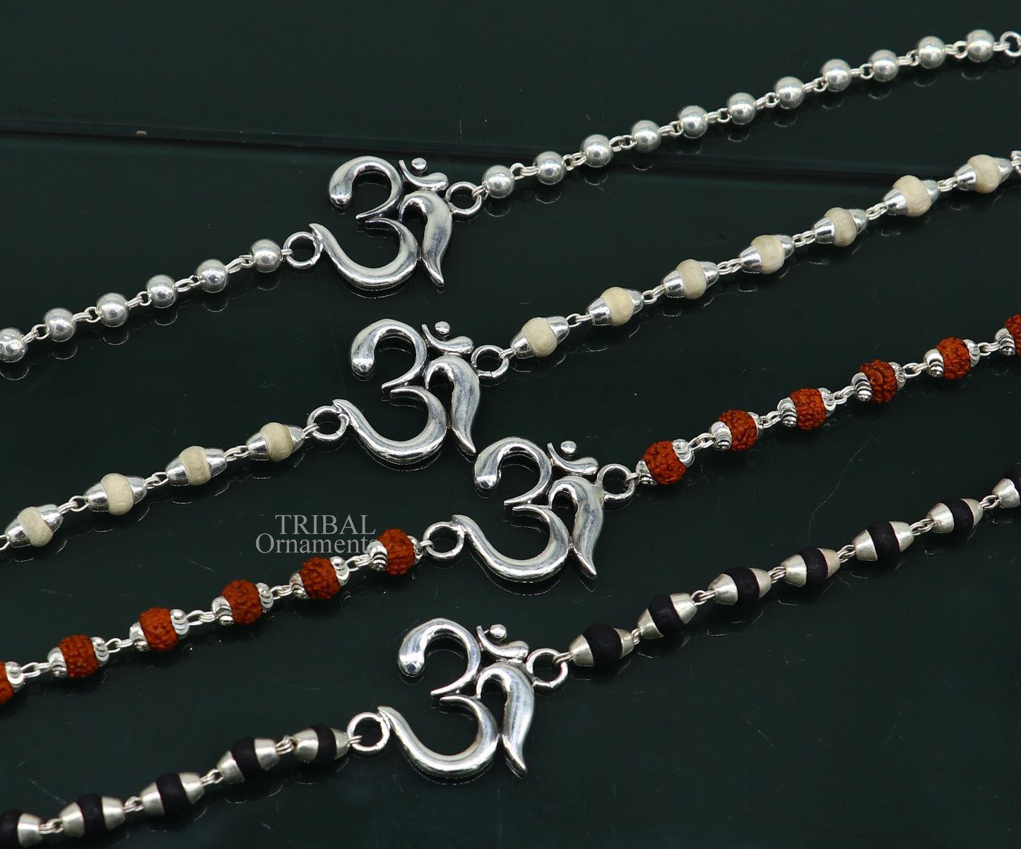 925 sterling silver Rudraksha and Tulsi beaded bracelet with OM design, handmade by Tribal Ornaments, ideal for rakhi gifting.