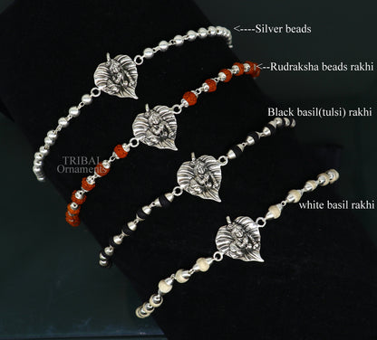 925 sterling silver Laddu Gopala bracelet with Rudraksha and Tulsi beads, featuring intricate Krishna design and beaded accents.