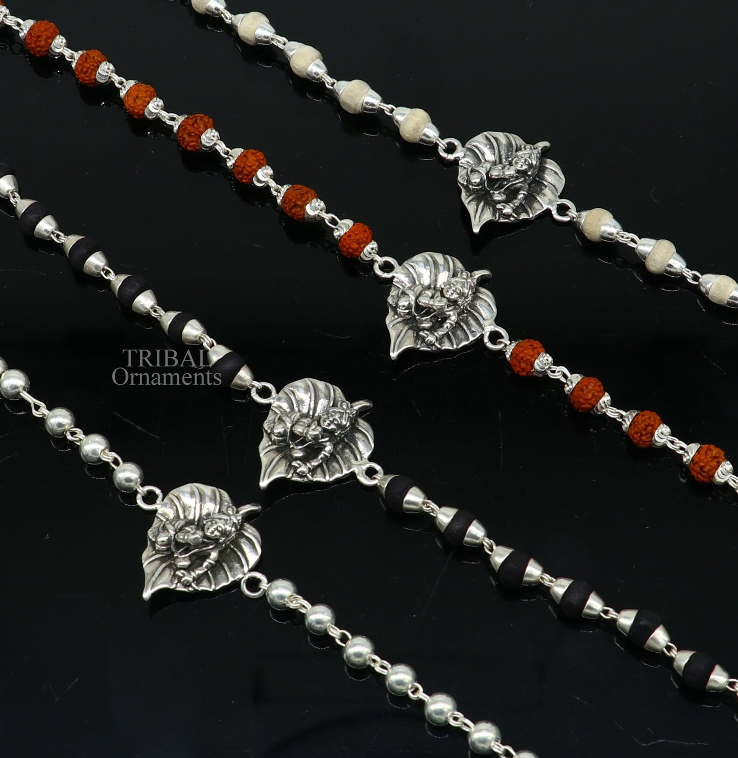 925 sterling silver Laddu Gopala design bracelet with Rudraksha and Tulsi beads, featuring intricate Krishna-inspired motifs.