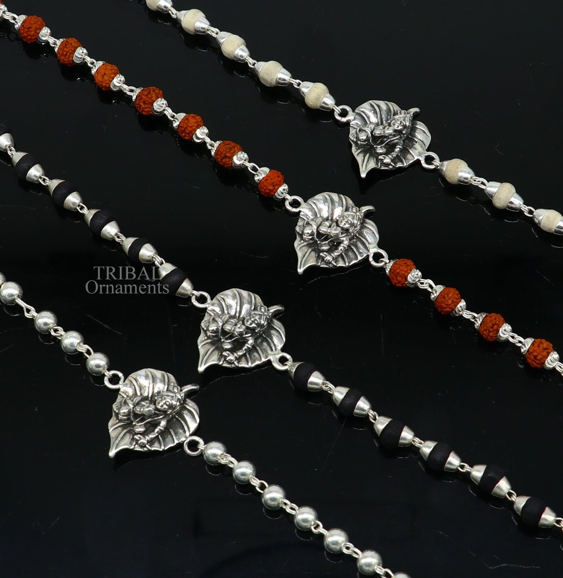925 sterling silver Laddu Gopala design bracelet with Rudraksha and Tulsi beads, featuring intricate Krishna-inspired motifs.