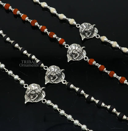 925 sterling silver Laddu Gopala design bracelet with Rudraksha and Tulsi beads, featuring intricate Krishna-inspired motifs.