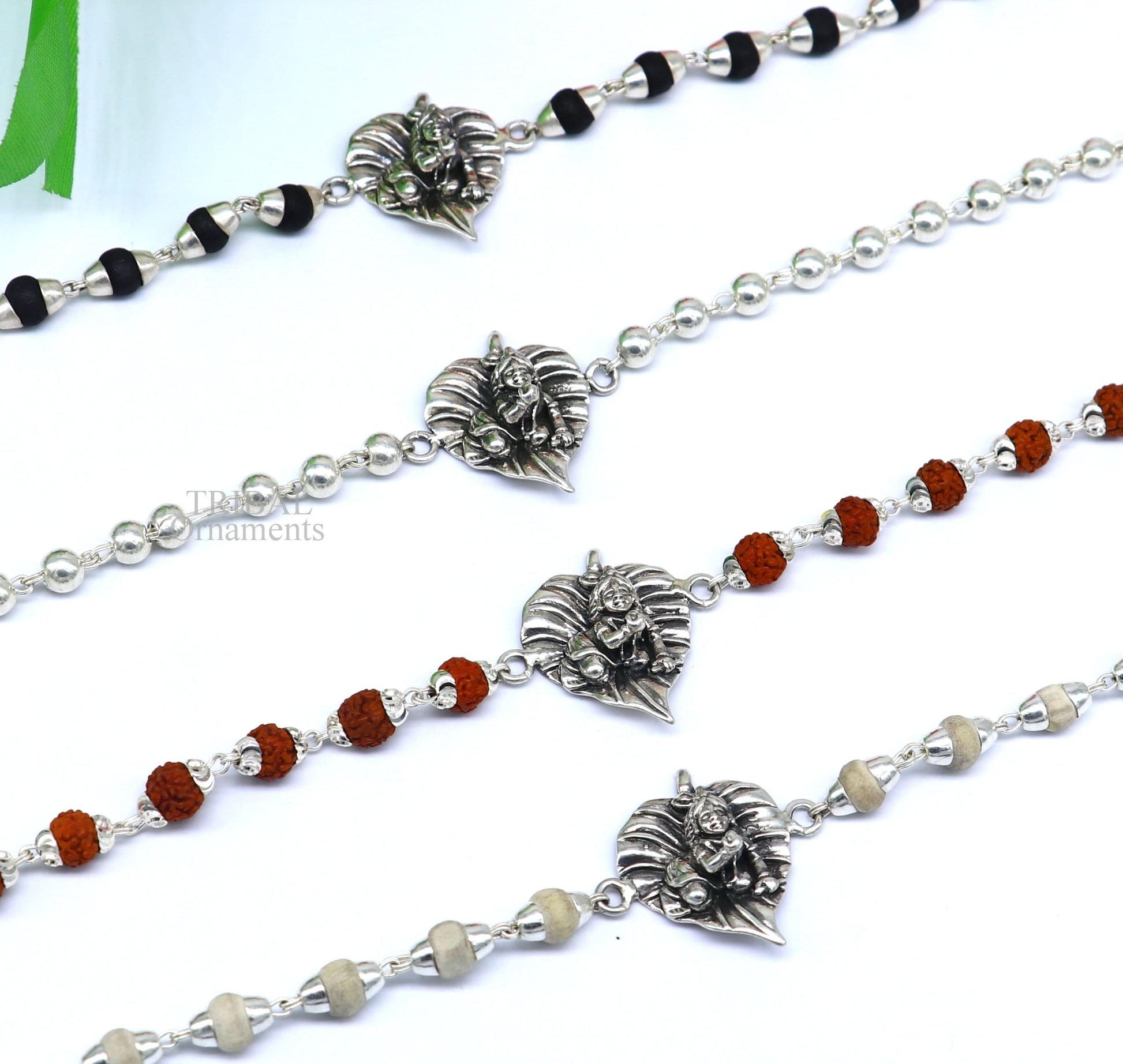 925 sterling silver Laddu Gopala design bracelet with Rudraksha and Tulsi beads, featuring intricate Krishna-themed jewelry by TRIBAL ORNAMENTS