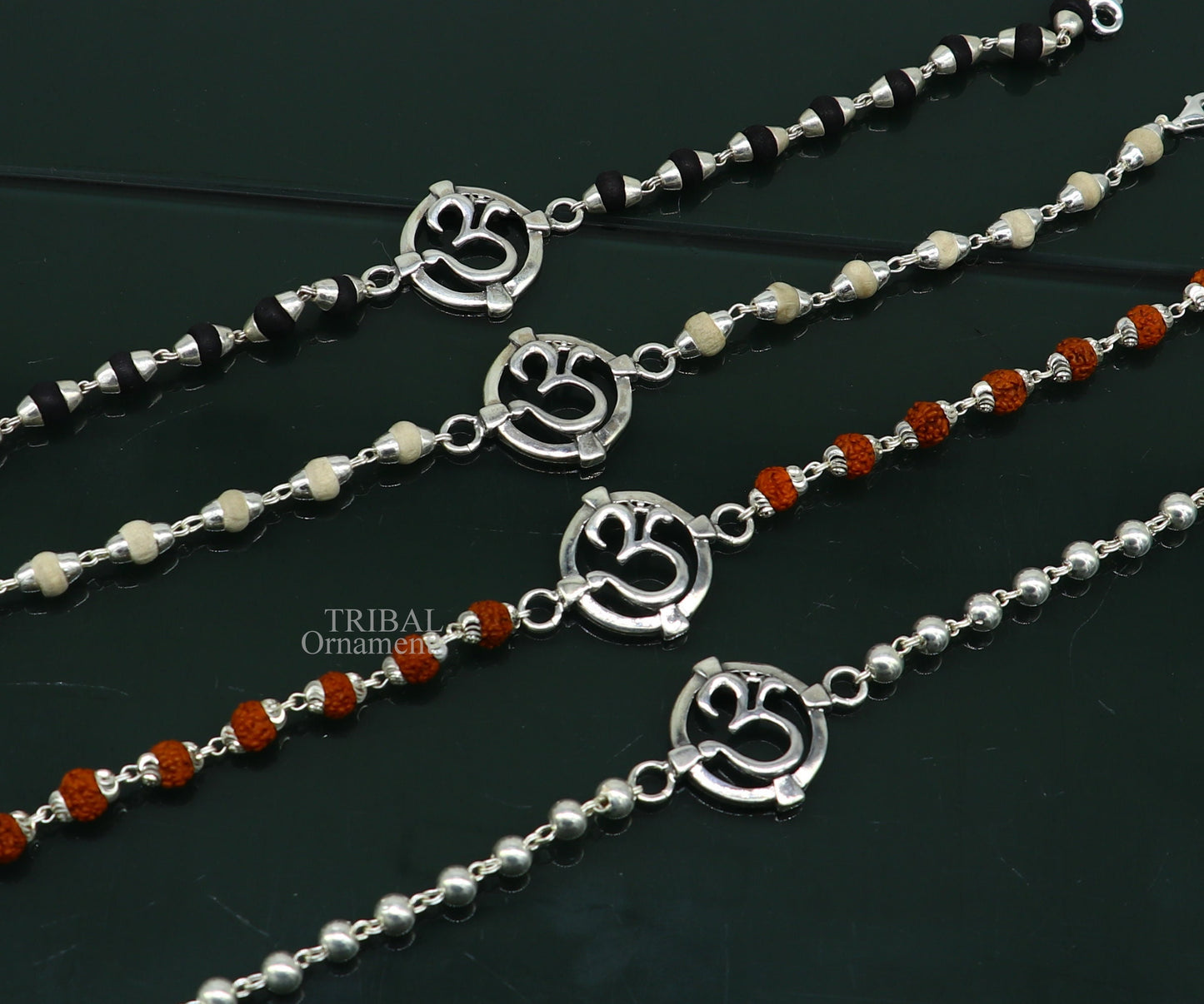 925 sterling silver Rudraksha beaded bracelet with OM design, featuring Tulsi and Rudraksha beads, crafted by TRIBAL ORNAMENTS.