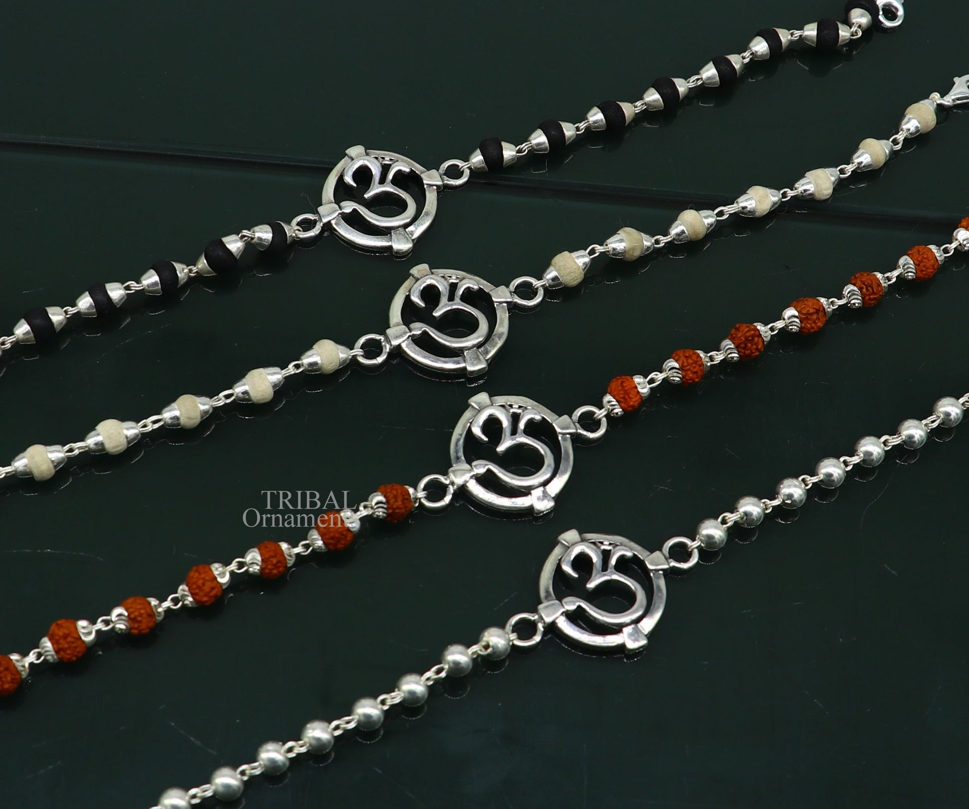 925 sterling silver Rudraksha beaded bracelet with OM design, featuring Tulsi and Rudraksha beads, crafted by TRIBAL ORNAMENTS.
