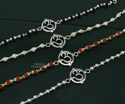 925 sterling silver Rudraksha beaded bracelet with OM design, featuring Tulsi and Rudraksha beads, crafted by TRIBAL ORNAMENTS.