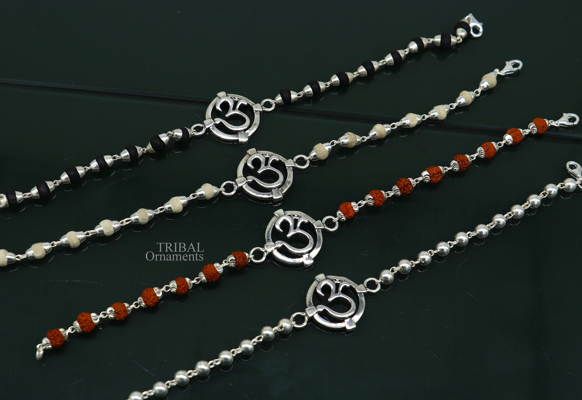 925 sterling silver OM design Rudraksha and Tulsi beaded bracelet with intricate mantra accents and traditional rakhi style.