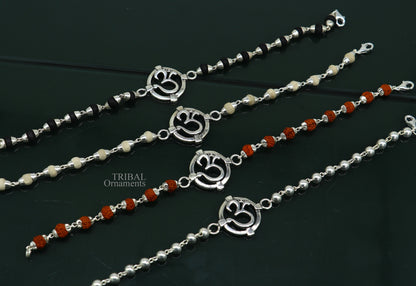 925 sterling silver OM design Rudraksha and Tulsi beaded bracelet with intricate mantra accents and traditional rakhi style.