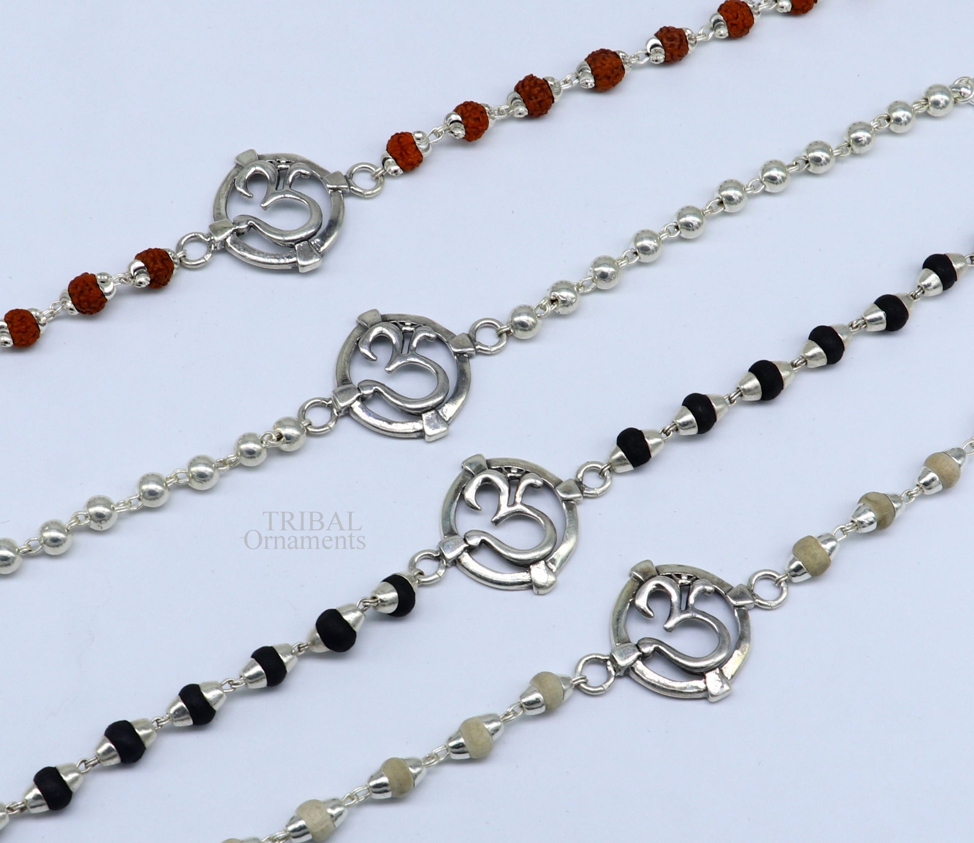 925 sterling silver Rudraksha and Tulsi beaded bracelet with OM design, featuring a mantra-inspired charm from TRIBAL ORNAMENTS.