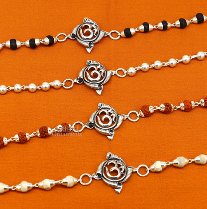 Sterling silver OM Rudraksha and Tulsi beads bracelet by TRIBAL ORNAMENTS, featuring handmade, stylish divine design.
