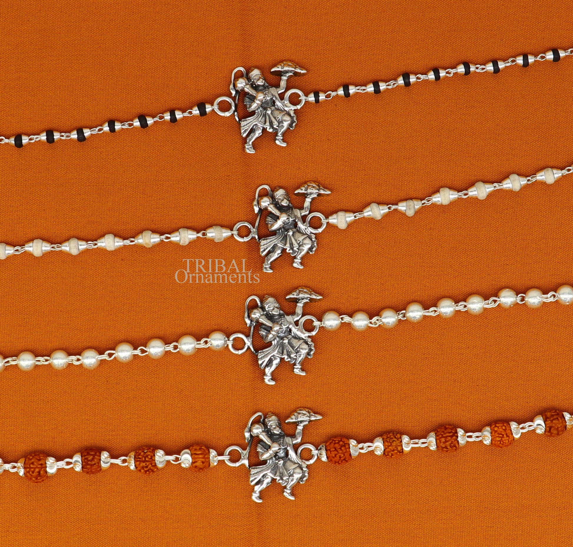 925 sterling silver Flying Hanuman Rudraksha and Tulsi beads bracelet rakhi with intricate silver detailing and beaded accents.