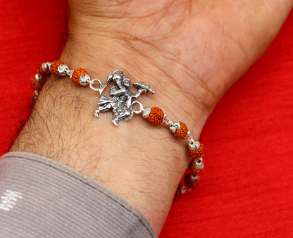 Sterling silver Flying Hanuman Rudraksha and Tulsi beads bracelet rakhi featuring intricate silver and bead design by TRIBAL ORNAMENTS