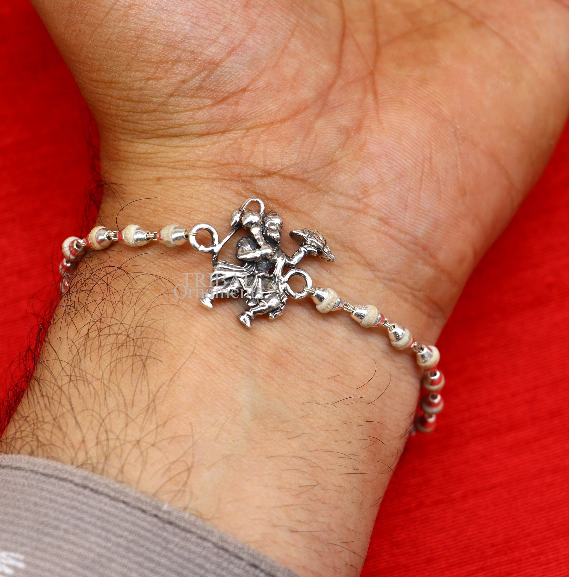 925 sterling silver Flying Hanuman Rudraksha and Tulsi beads bracelet rakhi with intricate silver details and beaded design.