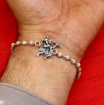 925 sterling silver Flying Hanuman Rudraksha and Tulsi beads bracelet rakhi with intricate silver details and beaded design.