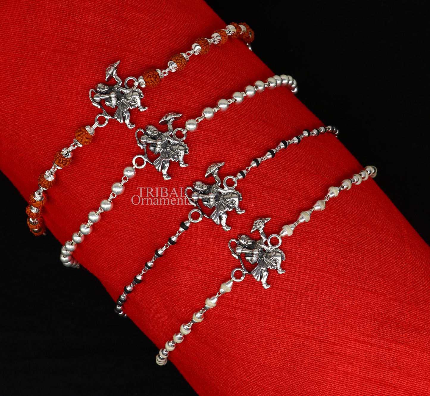 925 sterling silver Flying Hanuman Rudraksha and Tulsi beads bracelet rakhi with intricate silver details and beaded design.