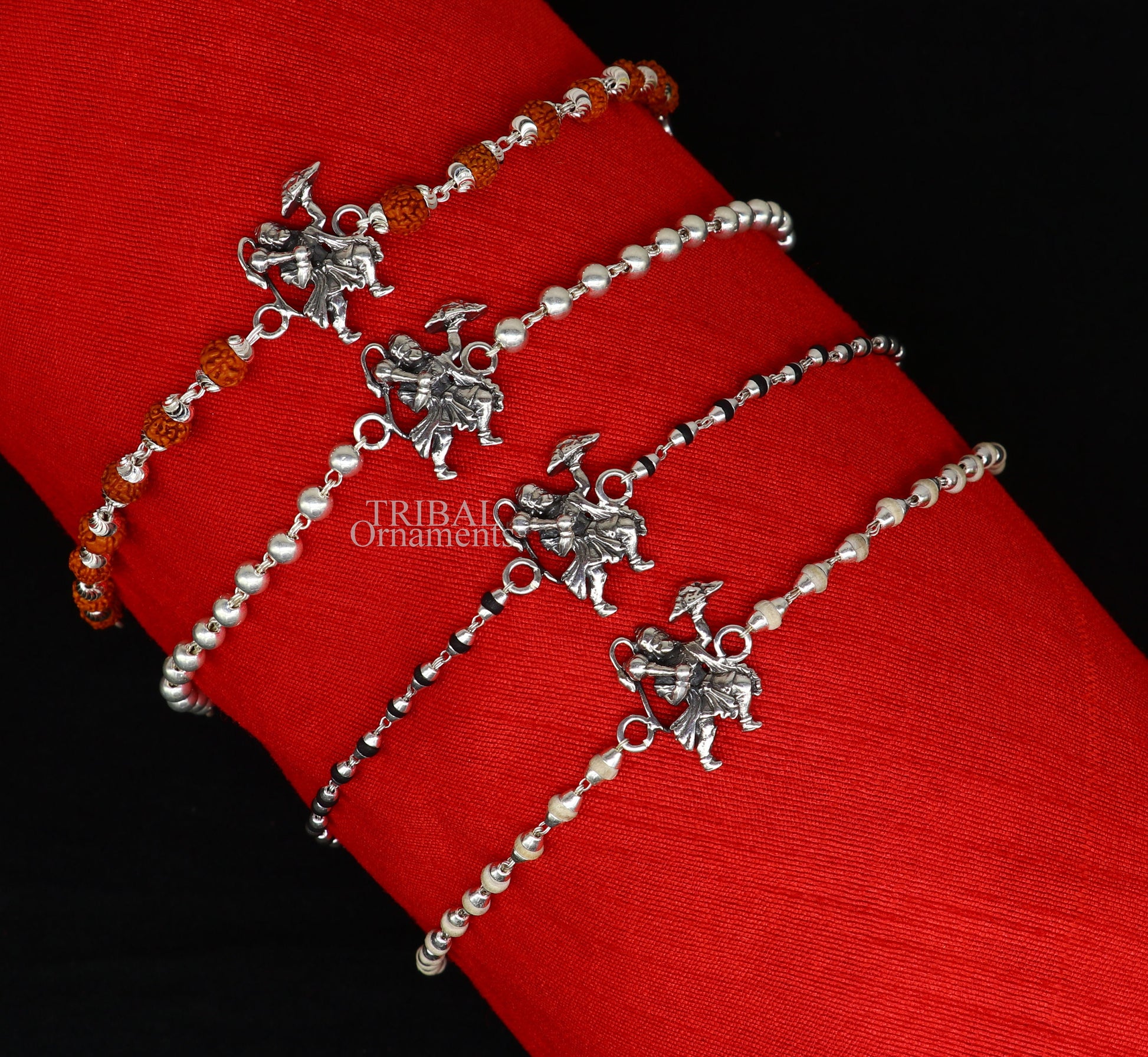 925 sterling silver Flying Hanuman Rudraksha and Tulsi beads bracelet rakhi with intricate silver details and beaded design.