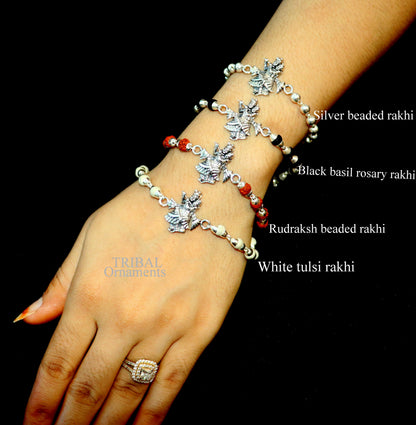 Handmade 925 sterling silver Lord Radha Krishna Rudraksha and Tulsi beads bracelet rakhi with intricate divine design.