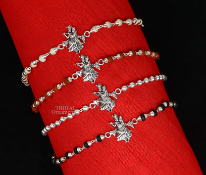 Handmade 925 sterling silver Lord Radha Krishna Rudraksha and Tulsi beads bracelet rakhi with intricate divine design.