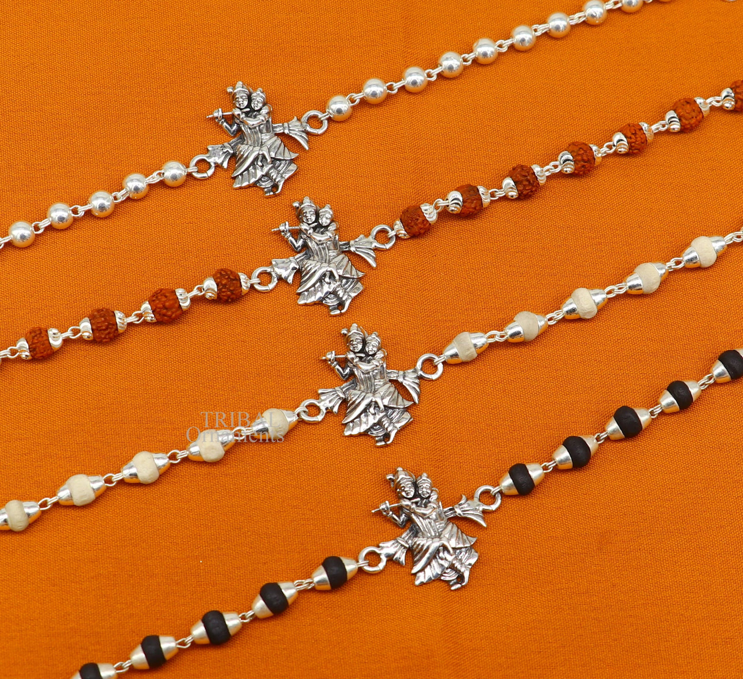 Handmade 925 sterling silver Lord Radha Krishna Rudraksha and Tulsi beads bracelet Rakhi with intricate divine design.