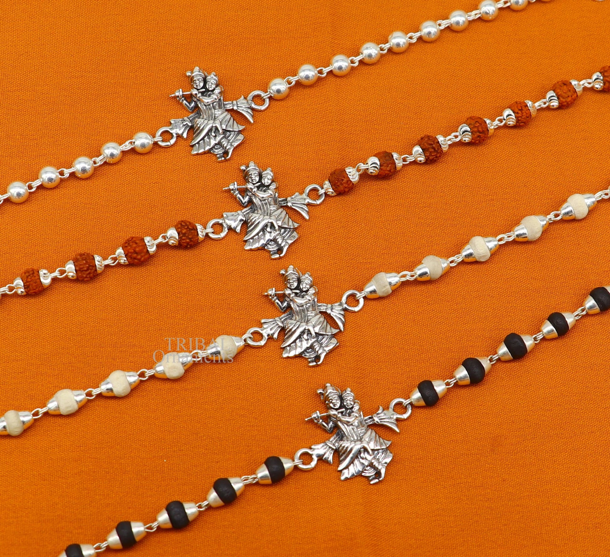 Handmade 925 sterling silver Lord Radha Krishna Rudraksha and Tulsi beads bracelet Rakhi with intricate divine design.