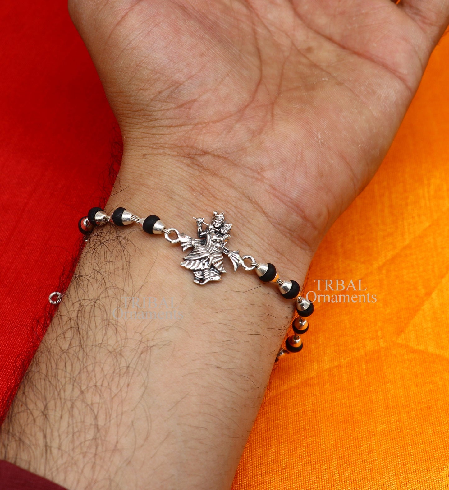 Handmade Lord Radha Krishna and Rudraksha beads bracelet in 925 sterling silver with Tulsi beads, crafted by Tribal Ornaments.