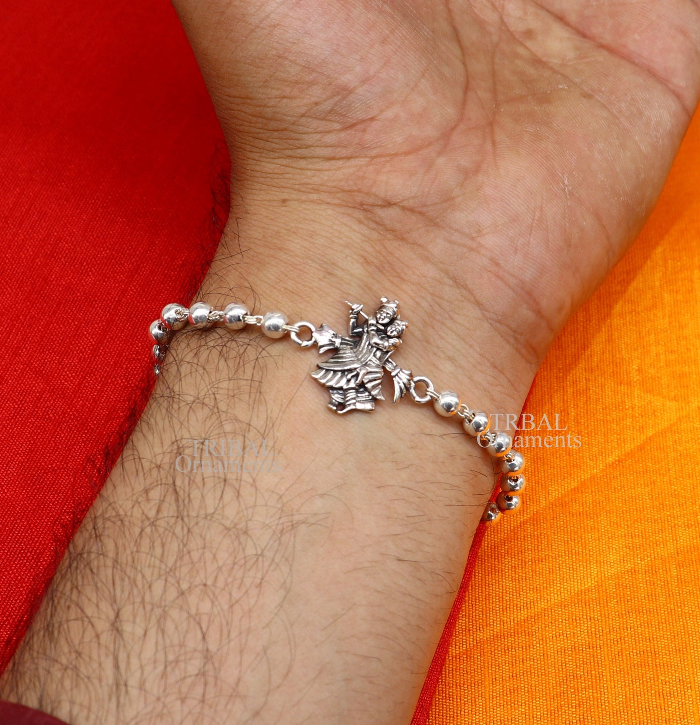 Handmade 925 sterling silver Lord Radha Krishna Rudraksha and Tulsi beads bracelet rakhi with intricate divine design.