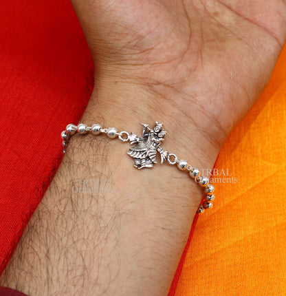 Handmade 925 sterling silver Lord Radha Krishna Rudraksha and Tulsi beads bracelet rakhi with intricate divine design.