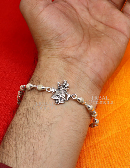 Handmade 925 sterling silver Lord Radha Krishna Rudraksha and Tulsi beads bracelet rakhi with intricate design and divine spiritual elements.