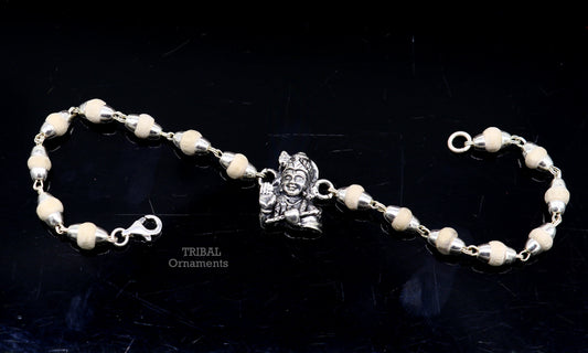 Sterling silver Lord Krishna bracelet by TRIBAL ORNAMENTS featuring personalized design and divine motifs, ideal for gifting.