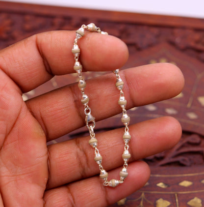 Sterling silver handmade unisex basil rosary beads bracelet, long and flexible, featuring tribal ornament jewelry design.