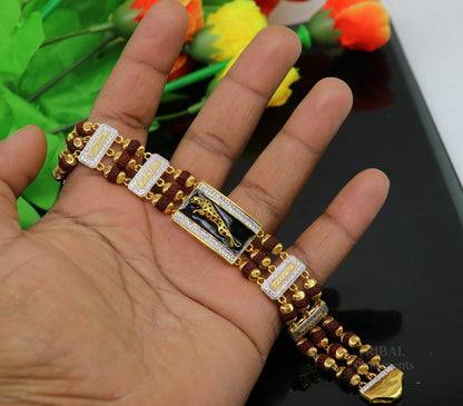22k yellow gold handmade Rudraksha beads bracelet with tiger design, crafted by TRIBAL ORNAMENTS, men's wedding jewelry.
