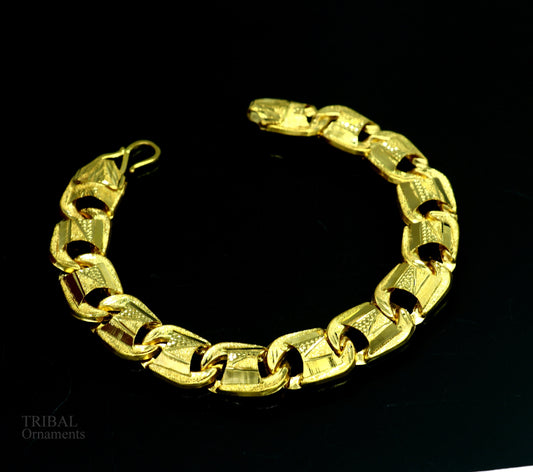22KT yellow gold handcrafted diamond-cut designer flexible bracelet by Tribal Ornaments, stylish unisex jewelry with unique design.