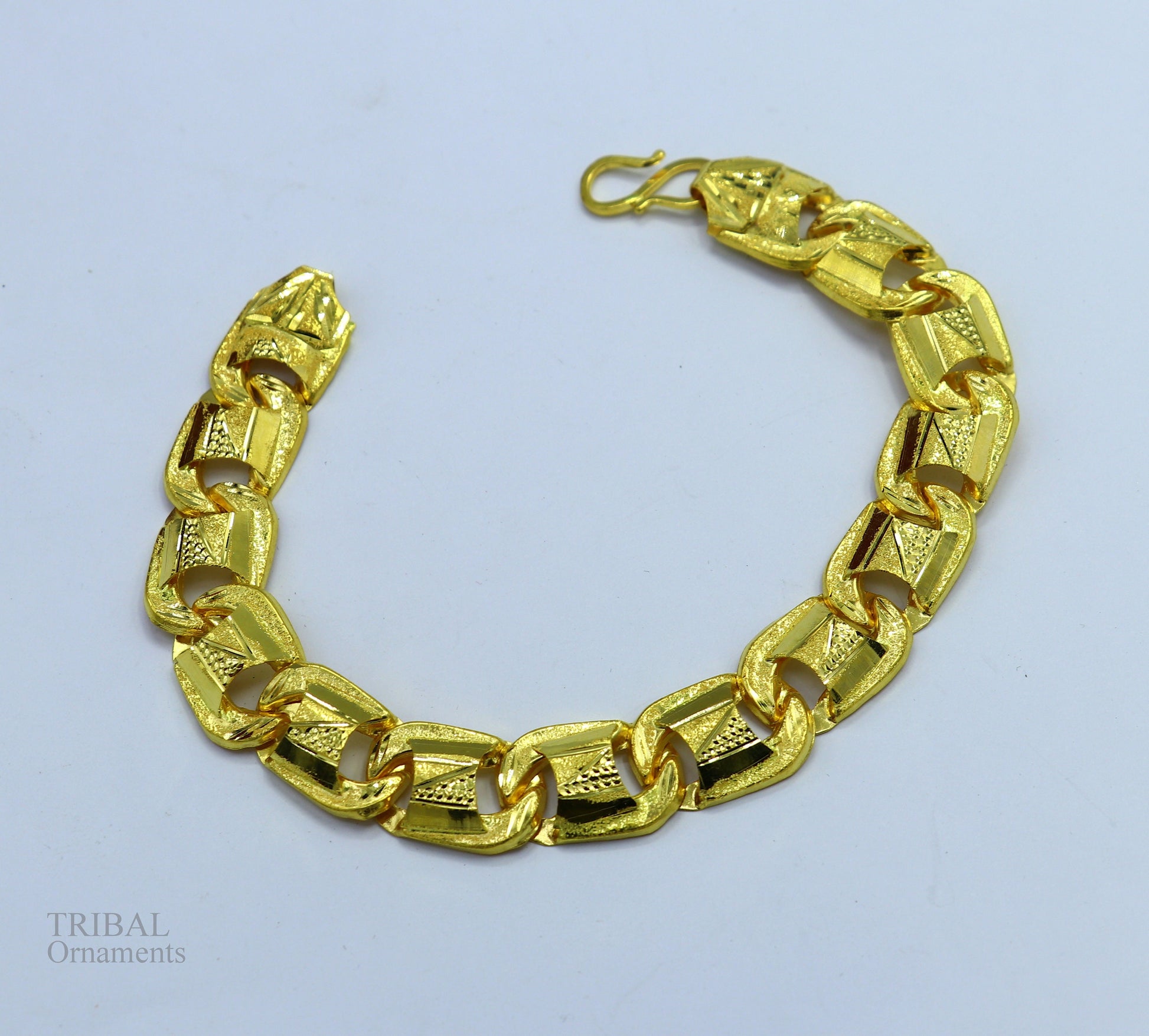 22KT yellow gold handcrafted designer flexible bracelet with diamond-cut details, stylish unisex jewelry from Tribal Ornaments.