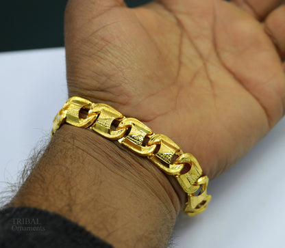 22KT yellow gold handcrafted diamond-cut designer flexible bracelet by TRIBAL ORNAMENTS, stylish unisex jewelry with intricate design.