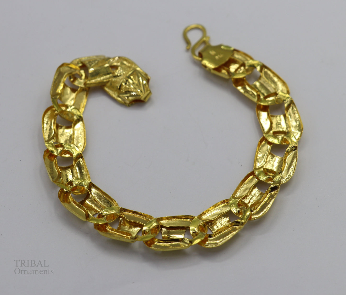 22KT yellow gold handcrafted diamond-cut designer flexible bracelet by Tribal Ornaments, stylish unisex jewelry with a unique design.