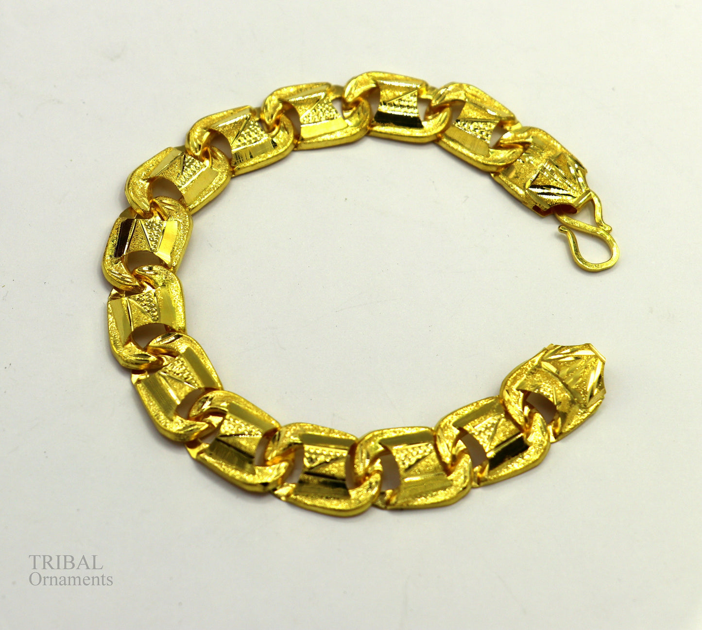 22KT yellow gold handcrafted diamond-cut designer flexible bracelet by Tribal Ornaments, stylish unisex jewelry with intricate design.