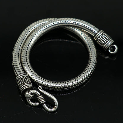 Sterling silver 4.5 mm snake chain bracelet by Tribal Ornaments, unisex vintage-style handmade jewelry with tribal design details.