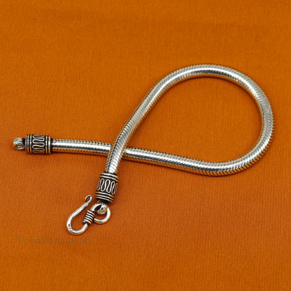 Sterling silver 4.5 mm snake chain bracelet by Tribal Ornaments, unisex vintage-style handmade jewelry with tribal design.