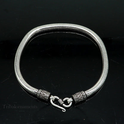 Sterling silver 4.5mm unisex snake chain bracelet by Tribal Ornaments, vintage style handmade jewelry with intricate craftsmanship.