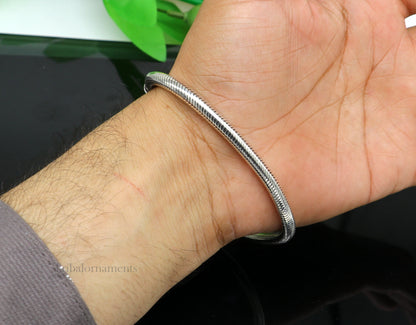 Sterling silver 4.5 mm snake chain bracelet by Tribal Ornaments, unisex vintage-style handmade jewelry with tribal design.