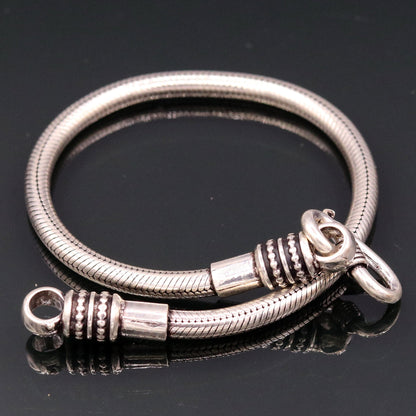 925 sterling silver snake chain bracelet by TRIBAL ORNAMENTS, flexible unisex jewelry with intricate handmade design from Rajasthan.