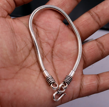 925 sterling silver snake chain bracelet by TRIBAL ORNAMENTS, flexible unisex jewelry with a sleek, handmade design from Rajasthan, India.