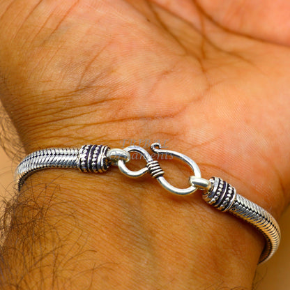 Sterling silver snake chain bracelet with D-shape design, handmade unisex jewelry by Tribal Ornaments, 5mm thickness, customizable.