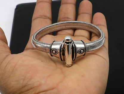 Sterling silver half-round D-shape snake chain bracelet by Tribal Ornaments, unisex, flexible heavy jewelry, intricate silver design.