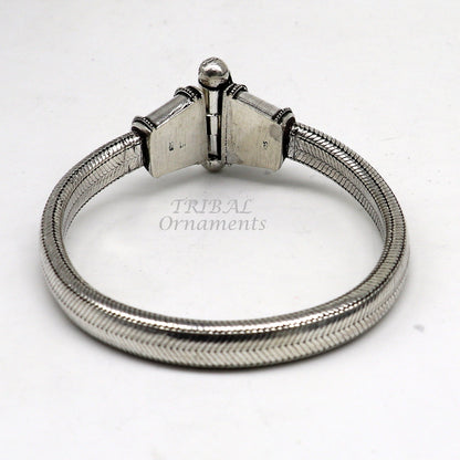 Sterling silver D-shaped snake chain bracelet by TRIBAL ORNAMENTS, flexible unisex jewelry with heavy, solid design.