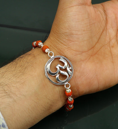 925 Sterling silver customized OM Rudraksha bead bracelet with Aum design from TRIBAL ORNAMENTS, featuring intricate bead details.