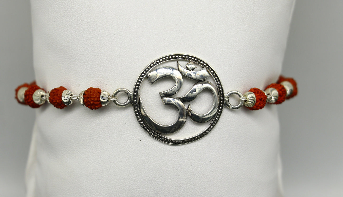 925 Sterling silver customized OM Rudraksha bead bracelet with Aum design from TRIBAL ORNAMENTS, featuring intricate beadwork.