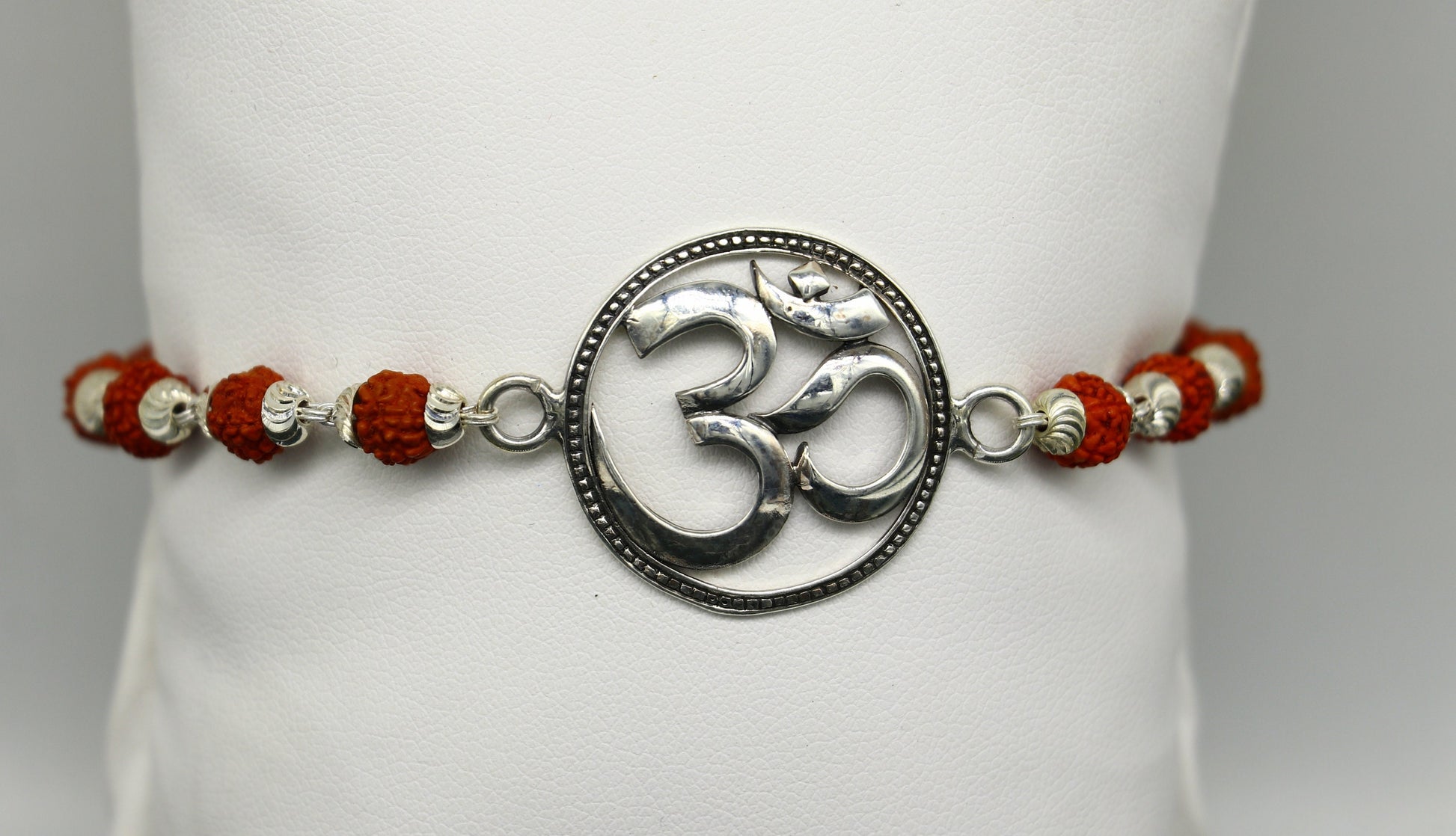 925 Sterling silver customized OM Rudraksha bead bracelet with Aum design from TRIBAL ORNAMENTS, featuring intricate beadwork.