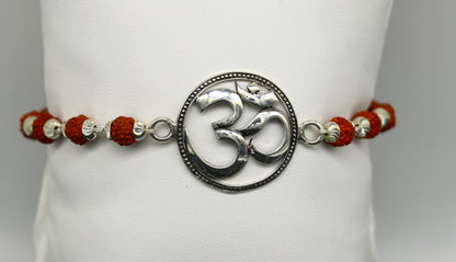 925 Sterling silver customized OM Rudraksha bead bracelet with Aum design from TRIBAL ORNAMENTS, featuring intricate beadwork.